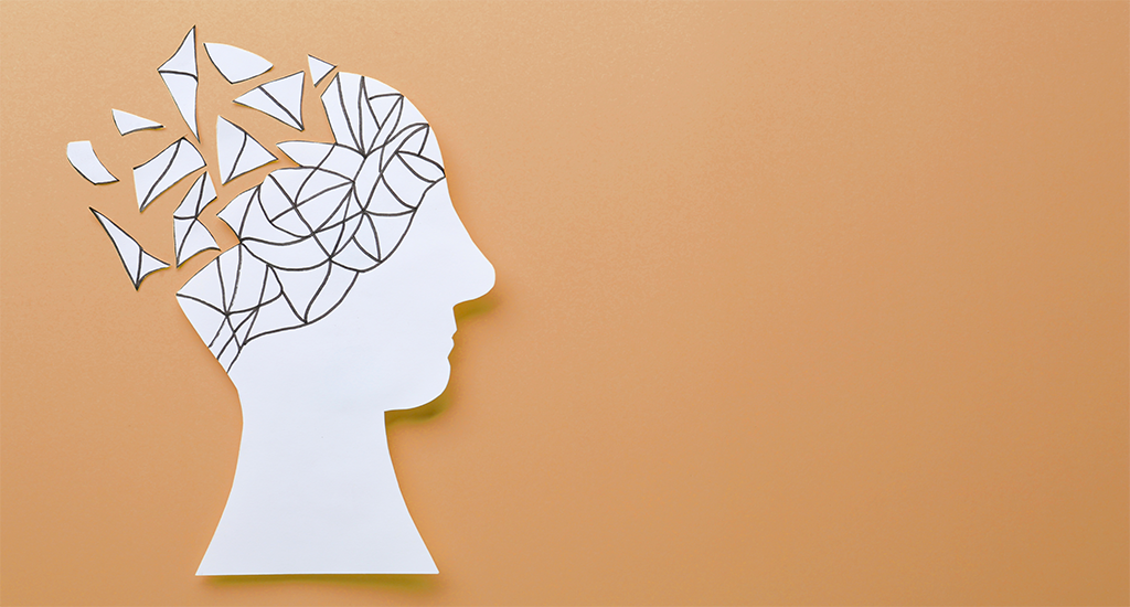 white head outline, brain shattered into pieces on a brownish background
